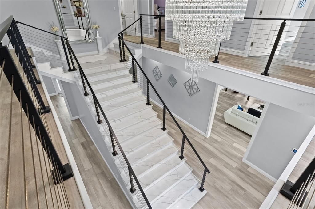 Grand Entryway & Majestic 2 Story Foyer with custom quartz staircase with modern cable railing