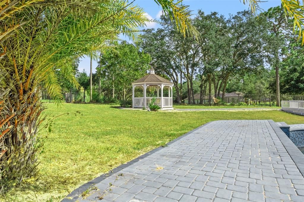 Backyard Gazebo, Perfect for hosting evening gatherings under the stars.