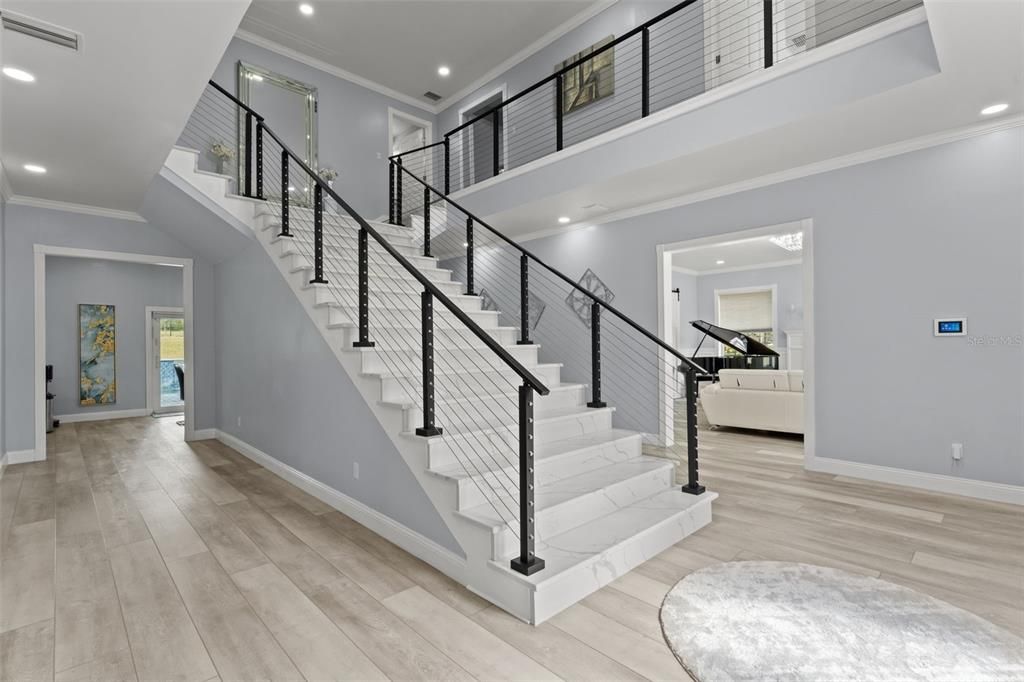 Majestic Two-Story Foyer Grand Entryway & Majestic 2 Story Foyer with custom quartz staircase with modern cable railing