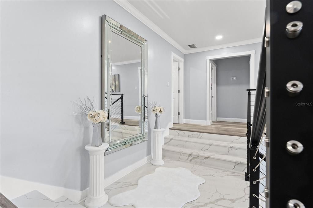 Walkway exiting the master suite towards the staircase and to the guest bedrooms