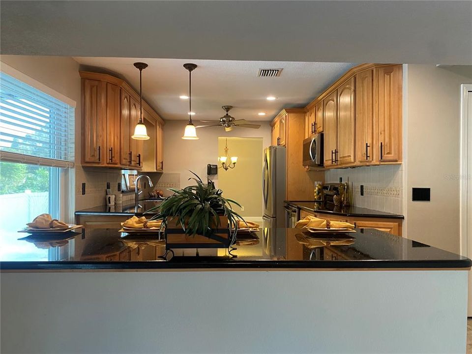 This is extra counter top but not an island. This is the half wall from the family room. The next picture will give you the full picture.