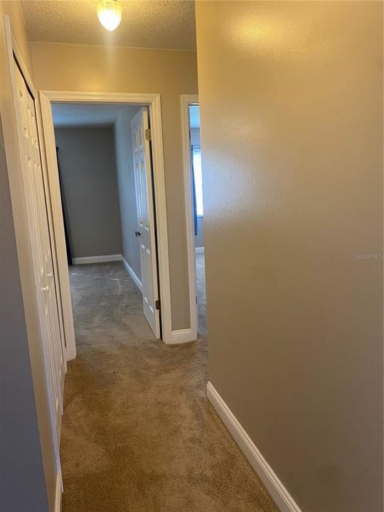 Upstairs hallway to two bedrooms and secondary bathroom. Owners retreat is directly behind this picture.