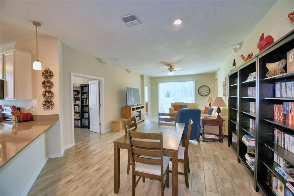 Dining area just off the kitchen. Bookshelves stay