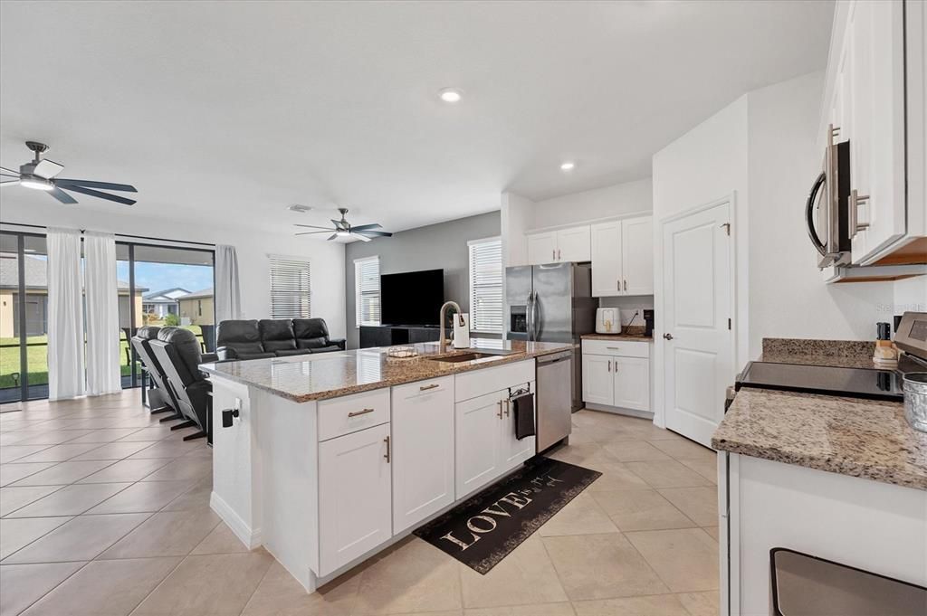 perspective from start of kitchen through to great room