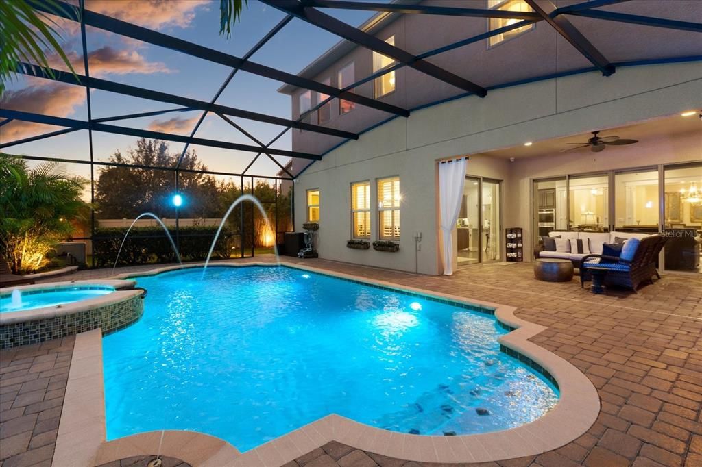 Pool and spa at twilight with lighting