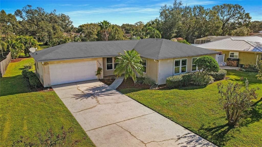 Large SCREENED PORCH and Extensive Bonus Concrete Patio all along the Rear of the Home Overlooks BIG, BACKYARD with Landscaping giving Pets and Kids Lots of Room to Run!