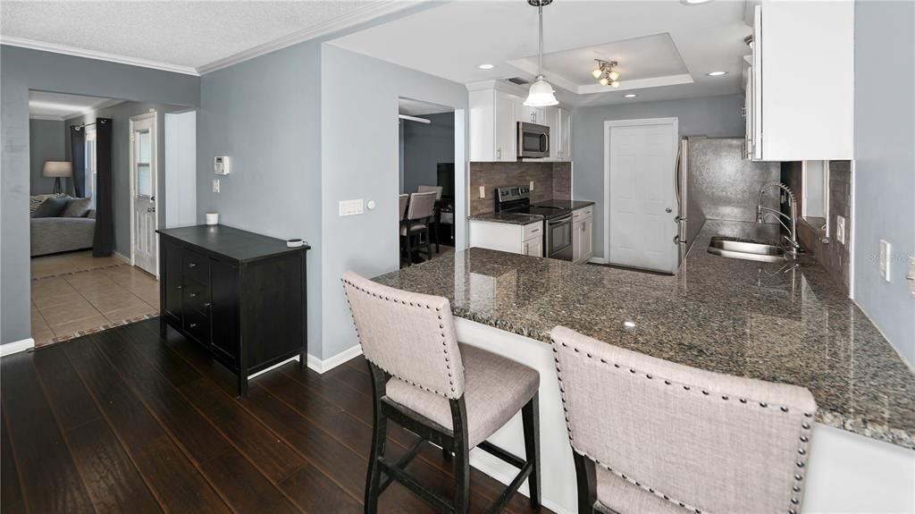 View from Family Room of Kitchen and Entry Foyer!