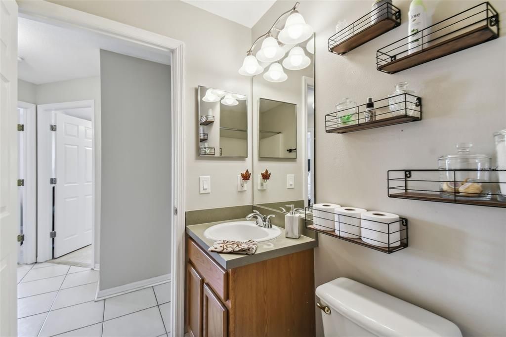 Guest bathroom is shared by bedrooms two and three across the hall