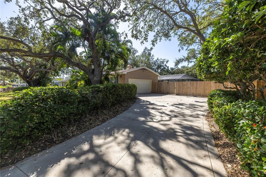 Driveway leads to the garage.