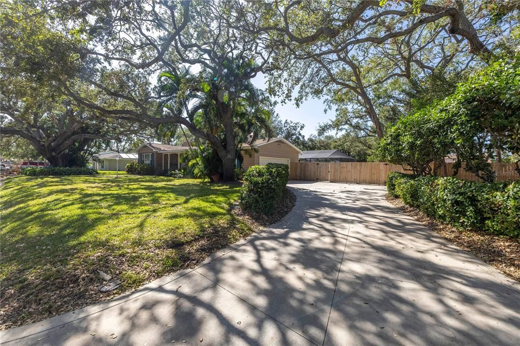 Driveway leads to the garage.