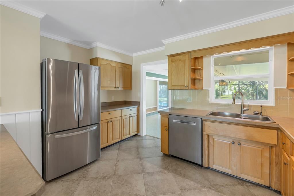 Kitchen features stainless steel appliances.