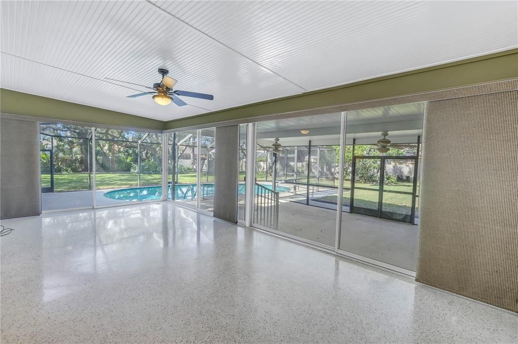 Florida room offers beautiful pool and back yard views.