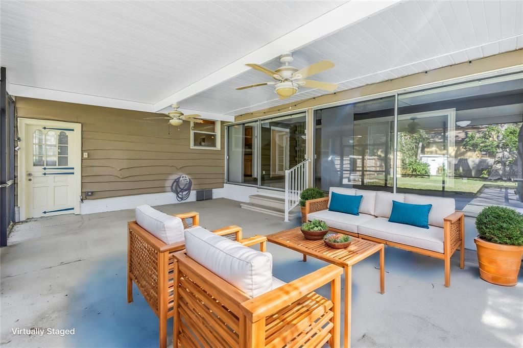 Virtually staged screened in patio.