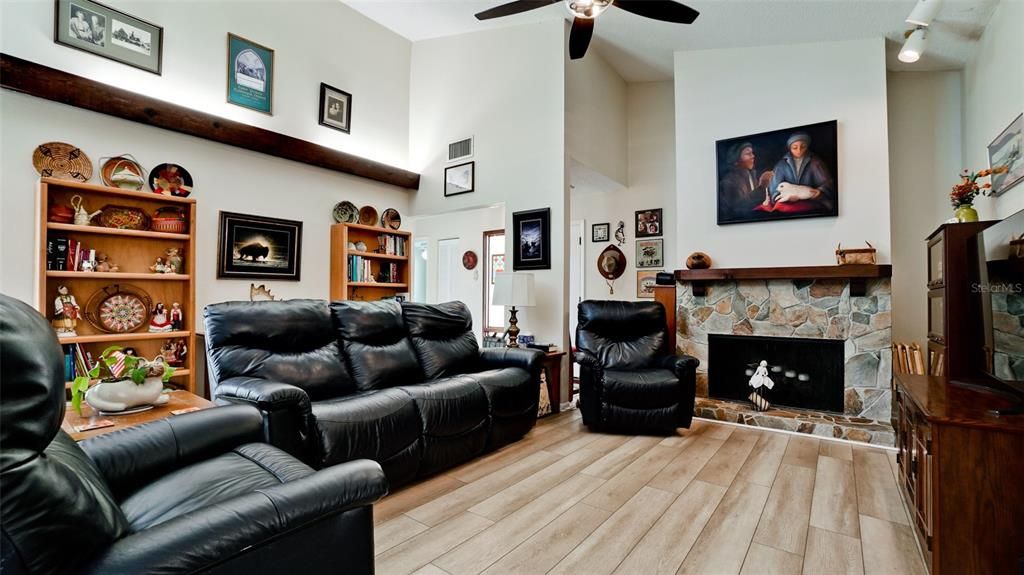 Living area with accent lighting and vaulted ceiling