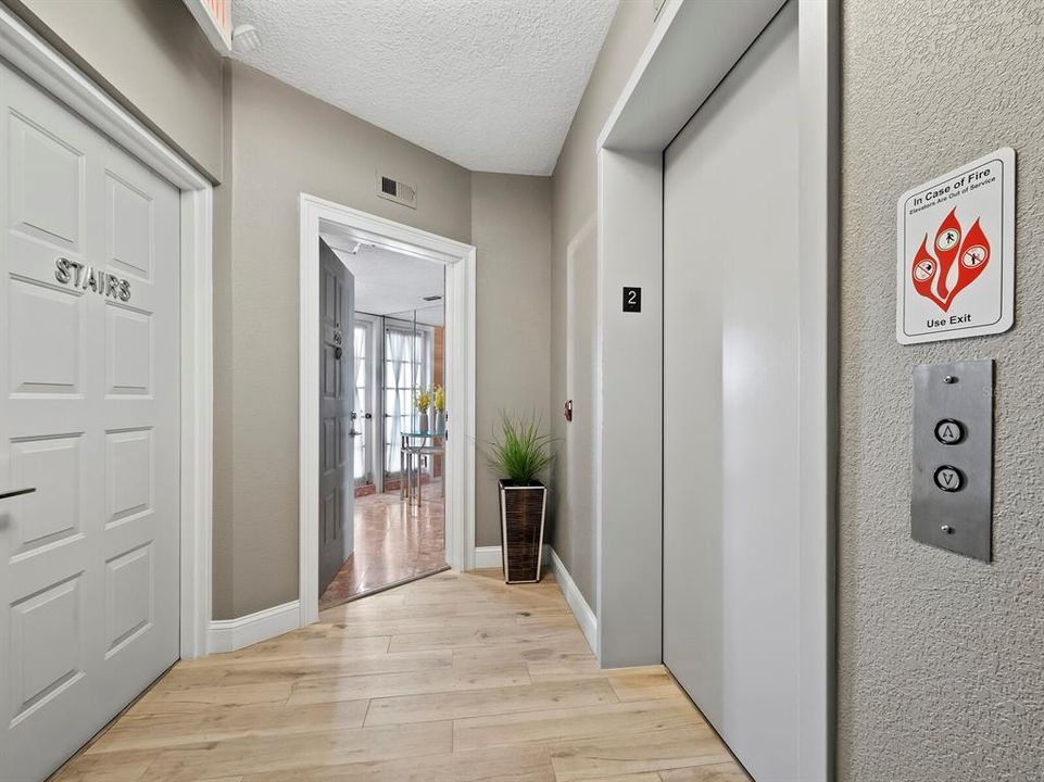 Take the Elevator or Stairs and arrive just outside your entry door, on the second floor landing. Shared with just one other residence, this landing offers a convenient Rubbish Chute just around the corner.