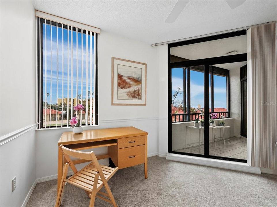 Sliding glass doors lead to the screened lanai.