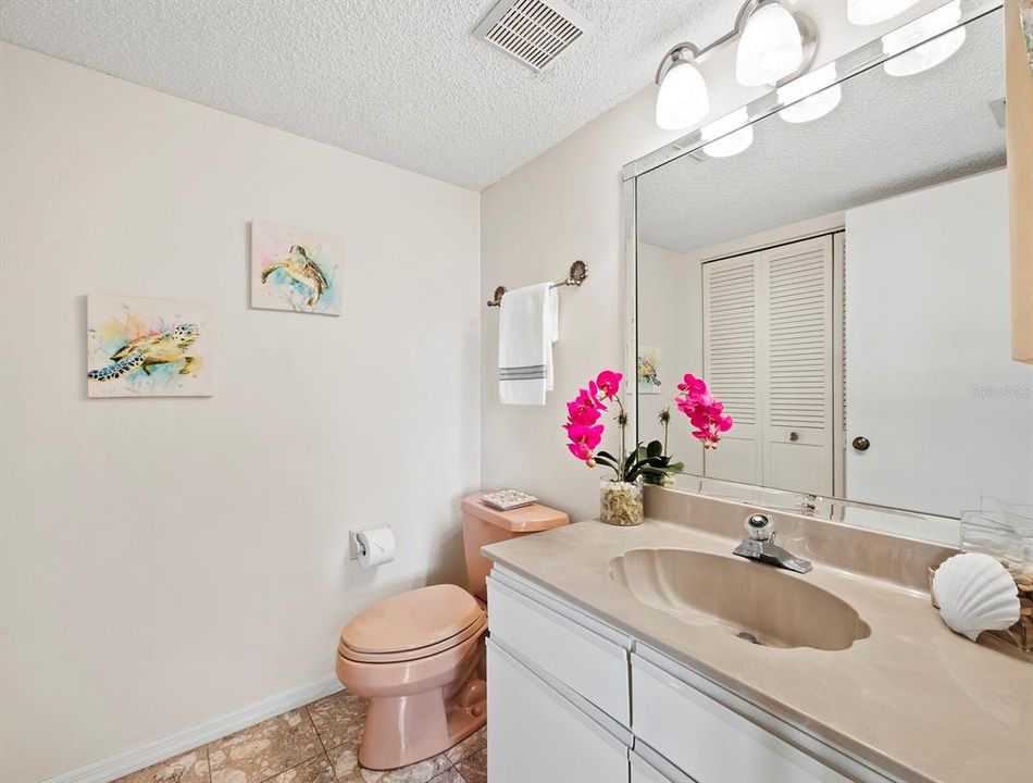 Conveniently located for your guests, near the great room and kitchen. Stackable washer and dryer concealed in the closet.