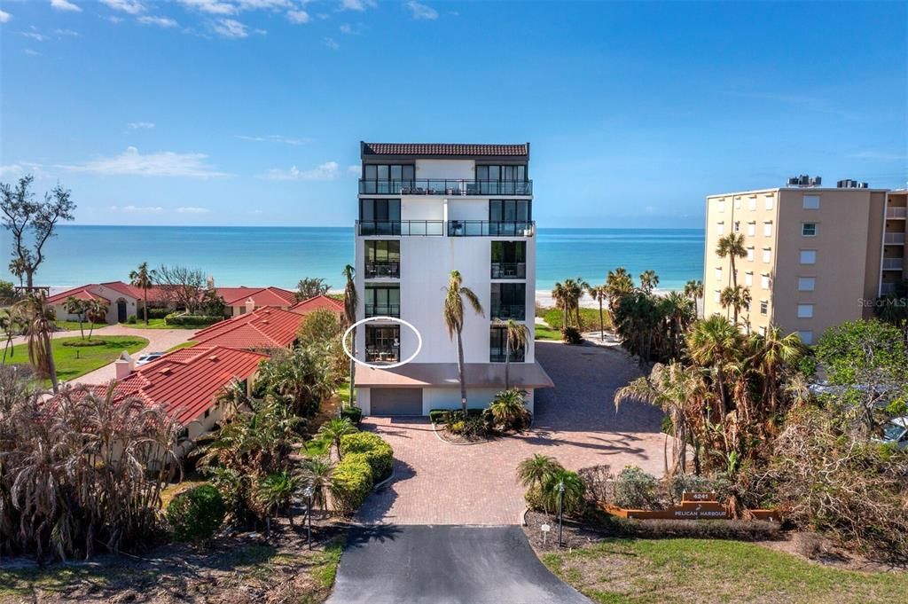 This second floor condo extends from the front to the back of the building, offering balconies to enjoy both sunrise and sunset.