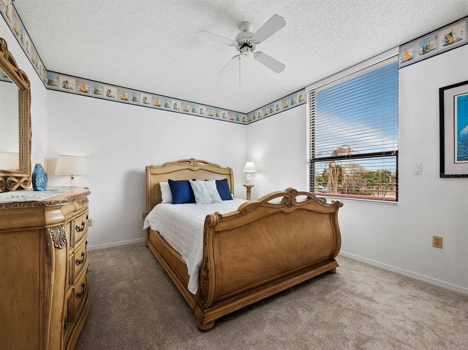 Spacious and Bright, this bedroom offers guests room to relax and a spacious built-in closet to stow their belongings.