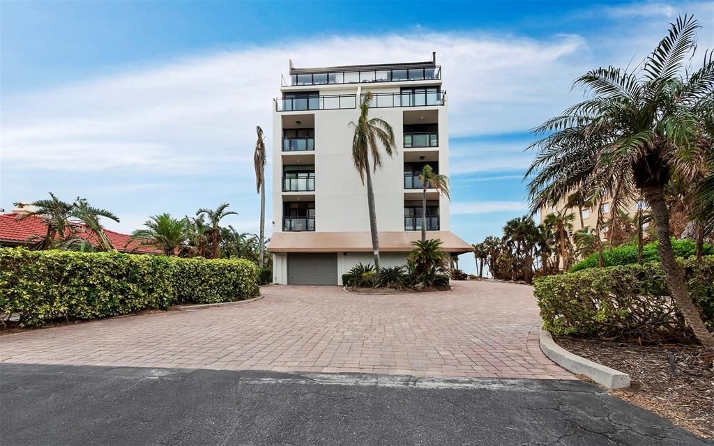 A brick paver parking lot greets you, on the west side of Gulf of Mexico Drive, to your beach front condo.