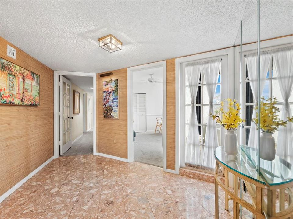 The Foyer - Situated in the center of the home, dividing the main living space from the bedrooms.