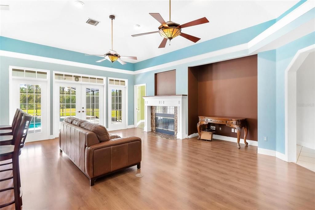 Living Area with French Doors leading to the Lanai and Pool Area