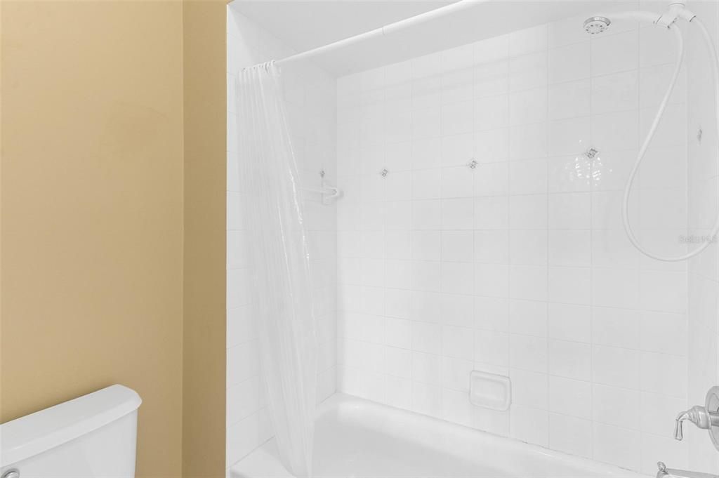 Guest Bathroom with Water Closet and Tub and Shower Combo