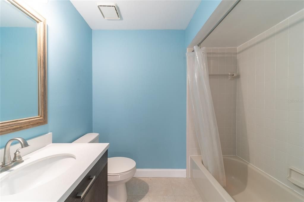 The second bathroom features a tub-shower combo.