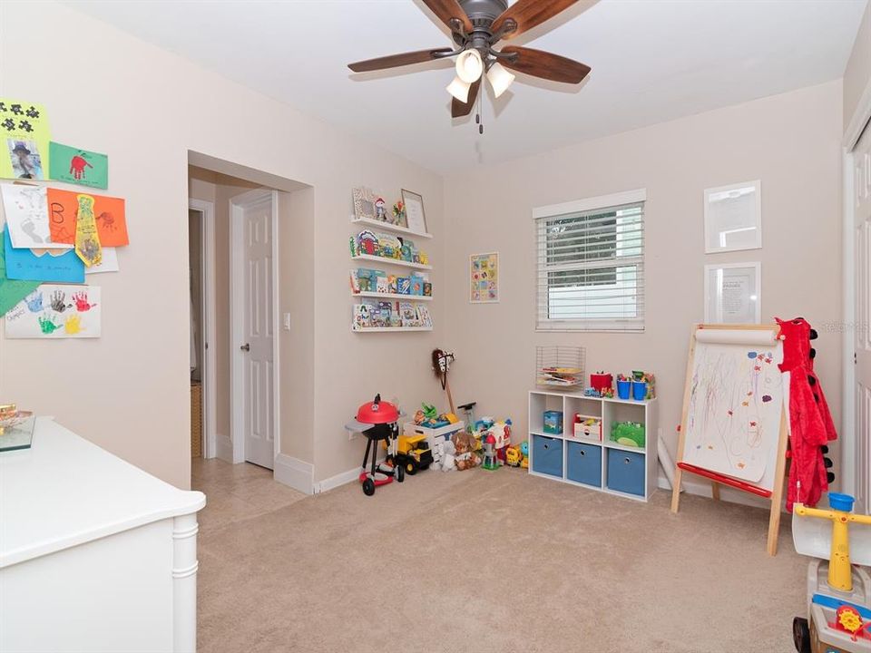 The third bedroom that is currently used as a playroom