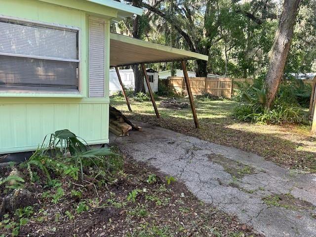 The carport on the back of the house. The living room is on this end of the home.