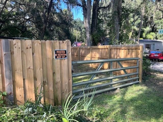 Drive gate along CR-412 to enter the property