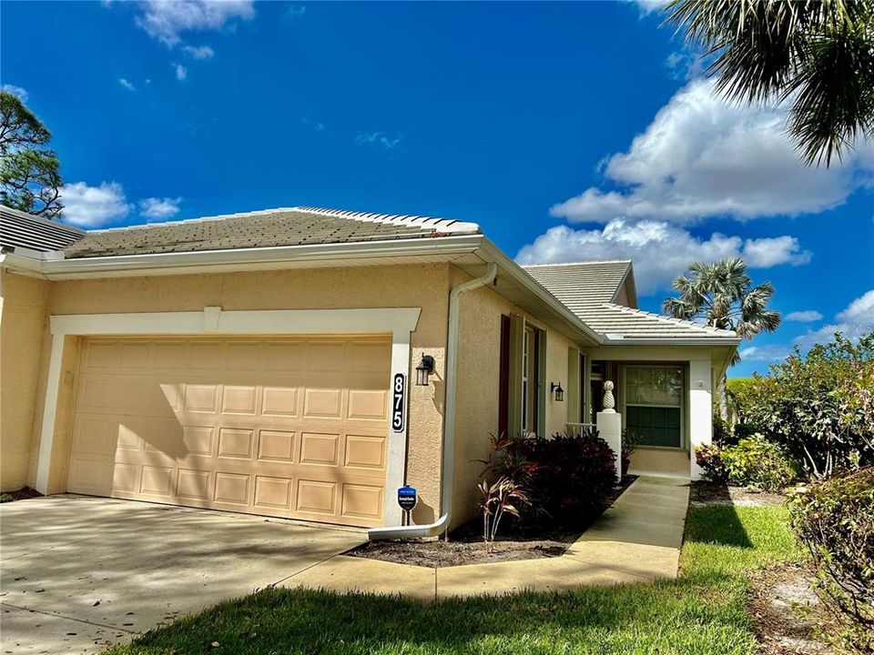 Front, walkway to side entrance