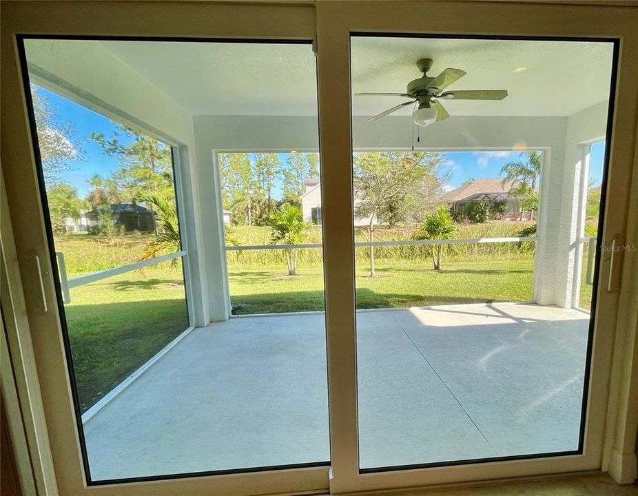 Sliders out to the screened Lanai from  the Dining area