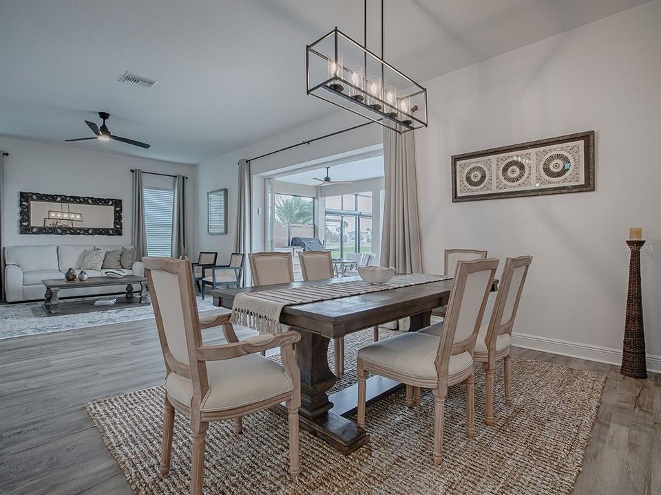 OPEN FLOOR PLAN FLOWS INTO THE LIVING ROOM.