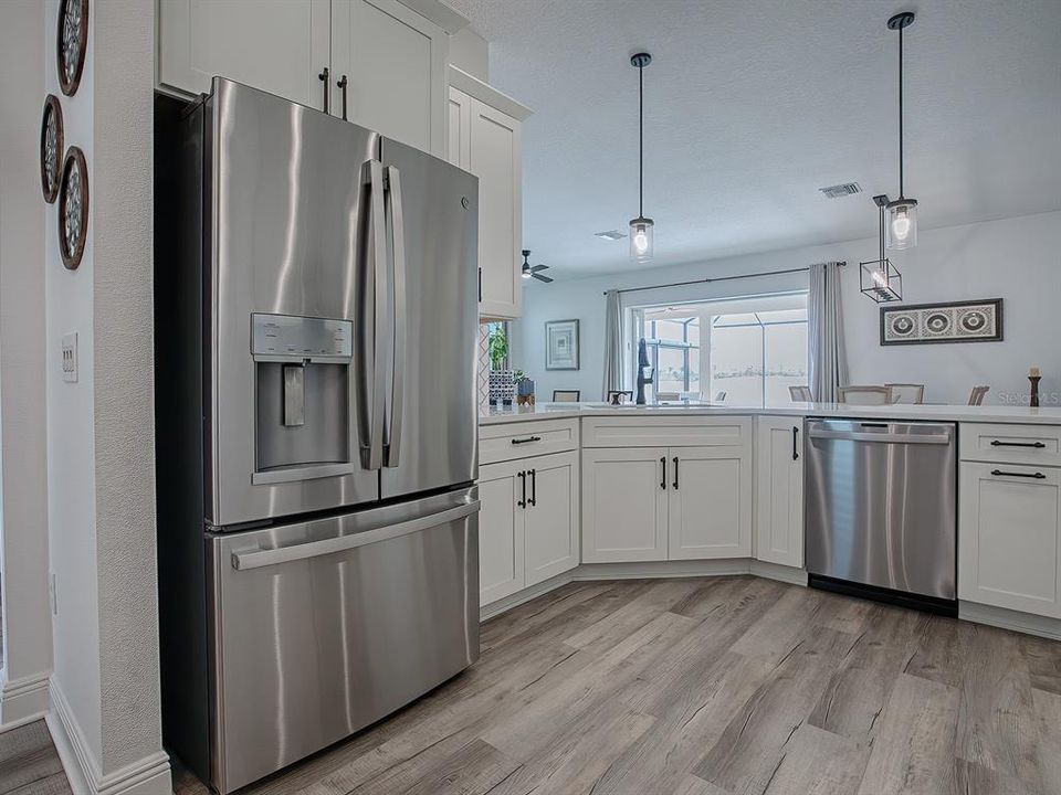 BOTTOM FREEZER REFRIGERATOR - PENDANT LIGHTING OVER THE BREAKFAST BAR.