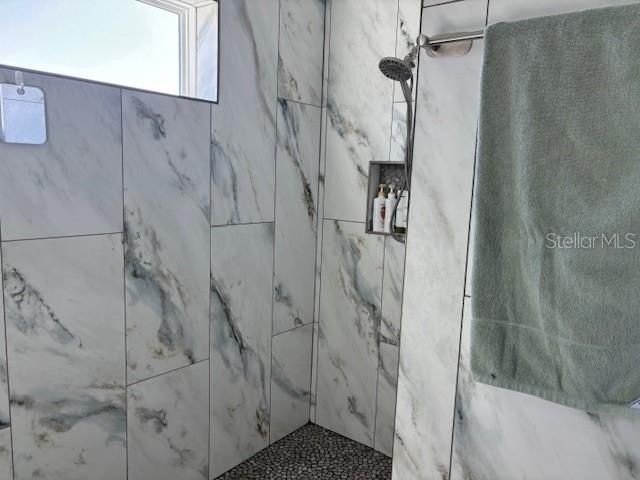 custom porcelain-tiled walk-in shower