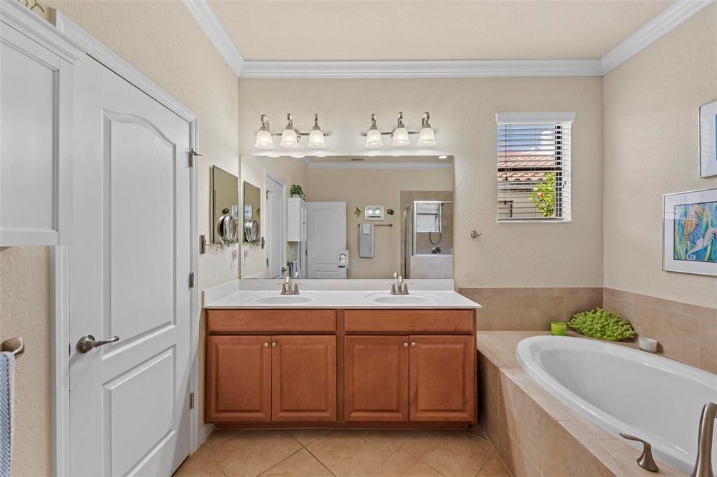 Owner's suite:  double vanity, garden tub, private water closet, shower and linen closet.