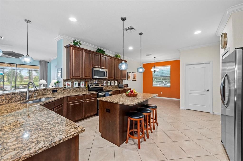 Open plan provides pool and lake view from kitchen counter and sink area.