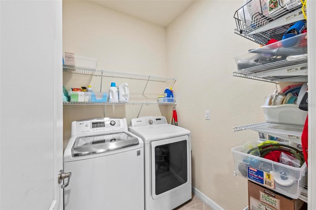 Laundry room with shelving/storage.