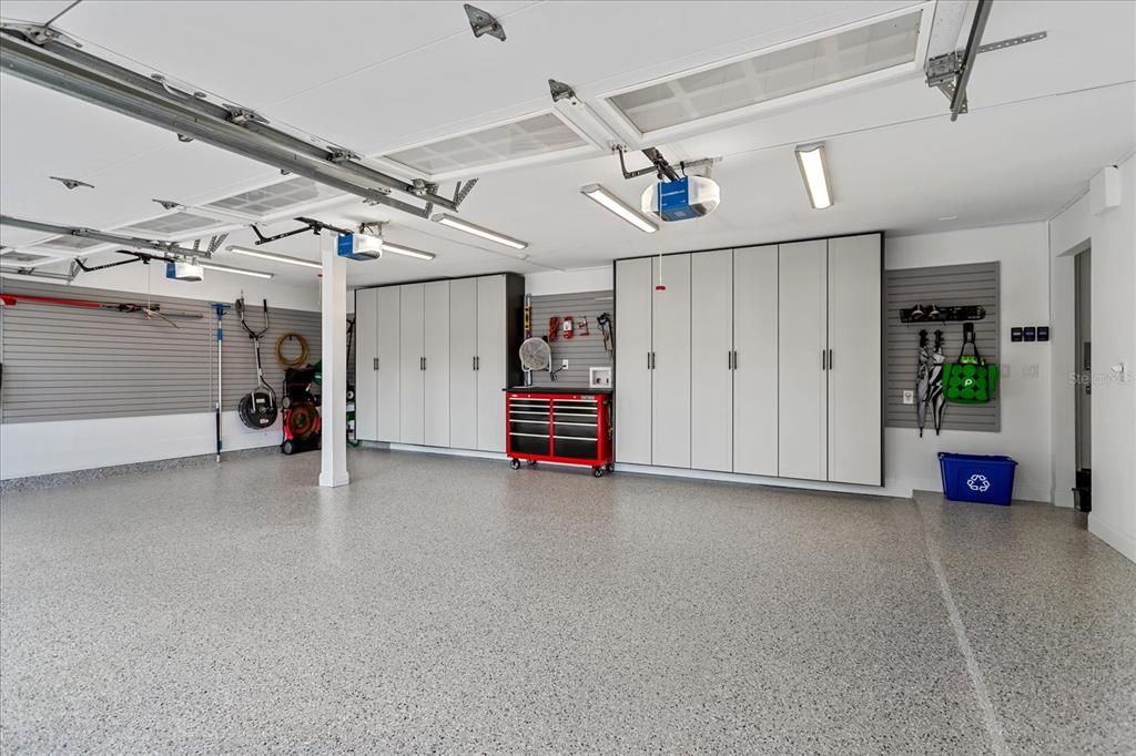 3 car Garage- recently added custom storage cabinets and Epoxy Flooring