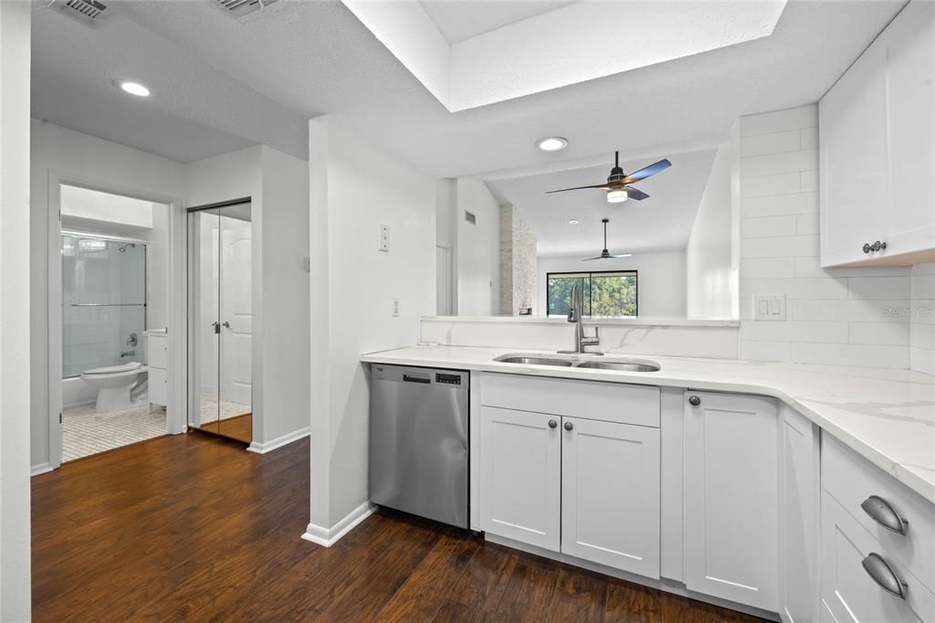 Remodeled kitchen featuring solid countertops.