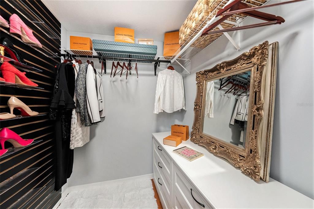 Primary bedroom walk-in closet