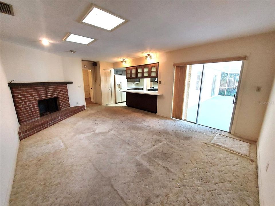 FAMILY ROOM WITH WOOD BURNING FIREPLACE