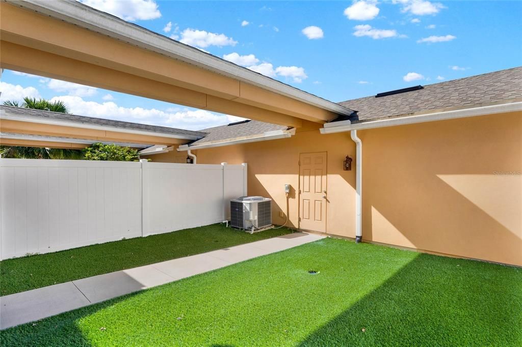 Covered walkway from the garage to the home