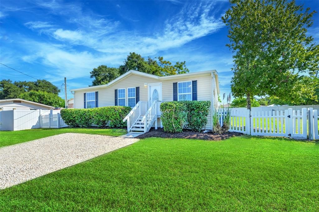 Small fence on right of home can be adjusted to open up for boat storage or additional items.