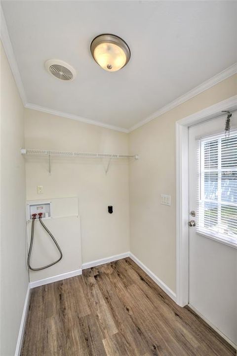 Laundry room off kitchen with access to rear yard.