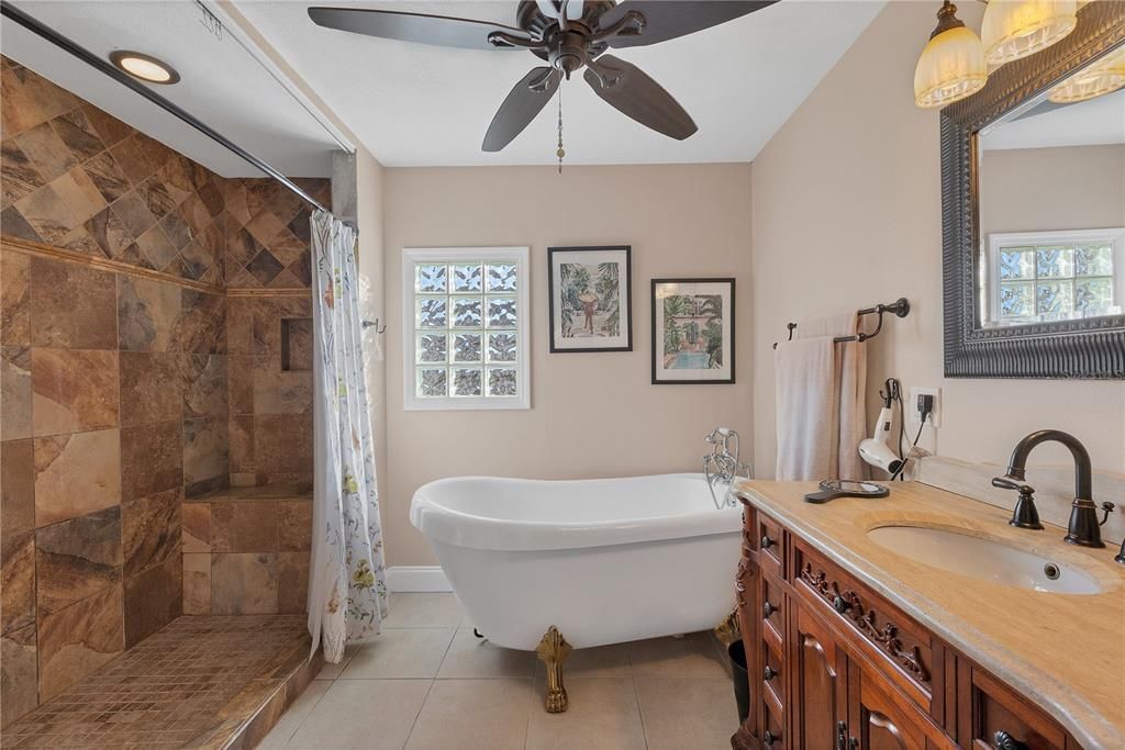 Owners ensuite bathroom features a clawfoot tub, and large walk-in shower.