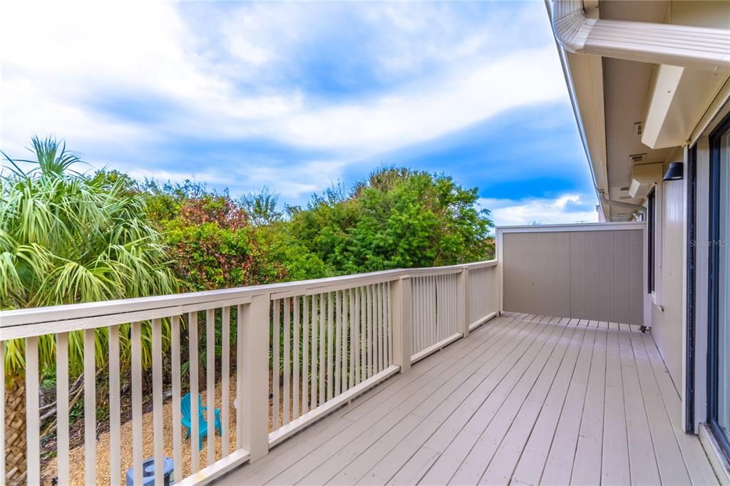 Upper level balcony, tree-lined views