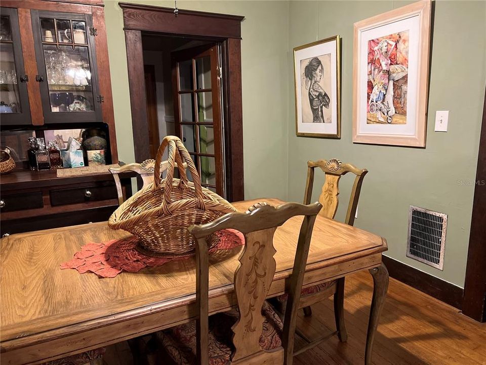 Dining Room with built in and french door to kitchen