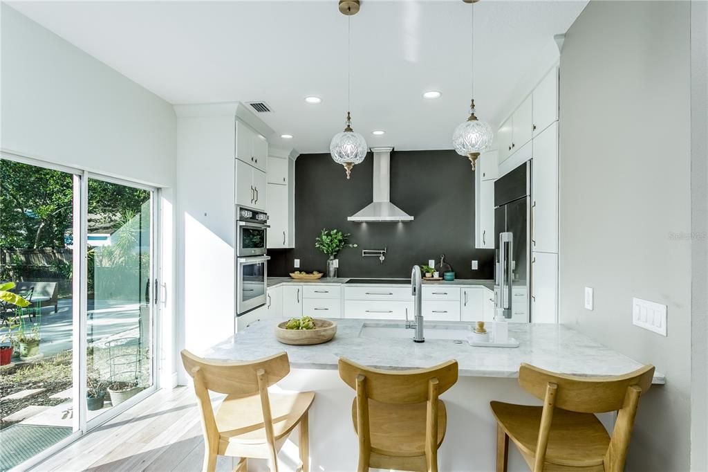 Kitchen with sliding doors to the fenced backyard